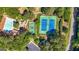 An aerial view showcases community amenities including tennis courts, basketball court, and a sparkling outdoor swimming pool at 130 Edgewater Trl, Fayetteville, GA 30215