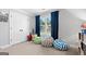 Bright bonus room with neutral walls and carpet with natural light at 130 Edgewater Trl, Fayetteville, GA 30215