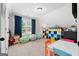 Bright bonus room with neutral walls and carpet with natural light at 130 Edgewater Trl, Fayetteville, GA 30215