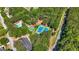 Aerial image featuring community amenities including a pool, tennis courts, and sports field at 130 Edgewater Trl, Fayetteville, GA 30215