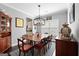 Formal dining room with stylish chandelier, elegant furnishings, and view of the kitchen at 130 Edgewater Trl, Fayetteville, GA 30215