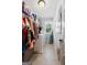 Well-organized laundry room with washer, dryer, storage shelves, and neutral gray walls at 130 Edgewater Trl, Fayetteville, GA 30215