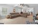 Open concept living room featuring coffered ceilings, neutral colors, and lots of natural light at 130 Edgewater Trl, Fayetteville, GA 30215