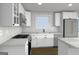Bright kitchen with white cabinets, stone countertops, stainless appliances, a gas cooktop, and hardwood floor at 4274 Kimball Sw Rd, Atlanta, GA 30331