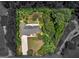 An aerial view of a home nestled among trees in a well maintained neighborhood at 264 Keller Dr, Mcdonough, GA 30252