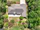Aerial view of the home surrounded by lush landscaping and mature trees, providing privacy and natural beauty at 264 Keller Dr, Mcdonough, GA 30252