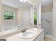 Bathroom features shower, bathtub, a large mirror and updated vanity at 264 Keller Dr, Mcdonough, GA 30252