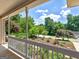 A view from the front porch with lovely mature trees and shrubs at 264 Keller Dr, Mcdonough, GA 30252