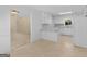 Bright eat-in kitchen features white cabinetry, countertops, and open access to another room at 264 Keller Dr, Mcdonough, GA 30252
