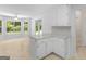 Bright eat-in kitchen features white cabinetry, countertops, and access to an outdoor space at 264 Keller Dr, Mcdonough, GA 30252
