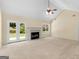 Bright living room with vaulted ceiling, fireplace, and access to the backyard at 264 Keller Dr, Mcdonough, GA 30252