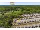 Aerial view of the community showcasing homes and proximity to Publix, offering convenience and a sense of community at 7435 Ansley Park Way, Cumming, GA 30028