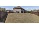 Expansive backyard with a wooden fence, providing ample space for various outdoor activities and potential landscaping at 7435 Ansley Park Way, Cumming, GA 30028