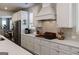 Gourmet kitchen featuring modern cabinetry, stainless appliances, and sleek countertops at 7435 Ansley Park Way, Cumming, GA 30028
