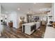 Open kitchen with island seating and modern appliances, perfect for entertaining and gathering at 7435 Ansley Park Way, Cumming, GA 30028