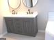 Bathroom with a modern gray double sink vanity and dual black framed mirrors at 7564 Mountain Ridge Ln, Lithonia, GA 30058