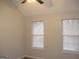 Bedroom with neutral paint and two windows allowing plenty of natural light at 7564 Mountain Ridge Ln, Lithonia, GA 30058