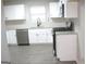 Bright kitchen featuring stainless steel appliances, light countertops, and white cabinets at 7564 Mountain Ridge Ln, Lithonia, GA 30058