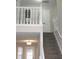View of the carpeted staircase with white railing leading to the upper level at 7564 Mountain Ridge Ln, Lithonia, GA 30058