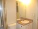 Small bathroom with a vanity, toilet and partial view of the shower at 4000 Orchard Hill Ter, Stone Mountain, GA 30083