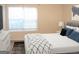 Bright bedroom with a large window, neutral walls, and modern decor at 4000 Orchard Hill Ter, Stone Mountain, GA 30083