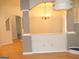Spacious dining room area featuring updated chandelier, hardwood floors, and neutral wall color at 4000 Orchard Hill Ter, Stone Mountain, GA 30083