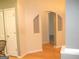 Hallway features hardwood floors and decorative archway between rooms at 4000 Orchard Hill Ter, Stone Mountain, GA 30083