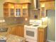 Stylish kitchen with custom cabinets, updated appliances, and decorative backsplash at 4000 Orchard Hill Ter, Stone Mountain, GA 30083