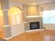 Bright living room featuring a fireplace and architectural columns, accentuated by natural light at 4000 Orchard Hill Ter, Stone Mountain, GA 30083