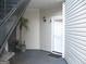 Outdoor space and front door outside the unit with room for seating and foliage at 4000 Orchard Hill Ter, Stone Mountain, GA 30083
