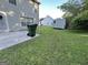 Spacious backyard featuring a patio, lush lawn and mature trees at 5627 Isleworth Ct, Atlanta, GA 30349