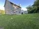 Spacious backyard featuring a patio, lush lawn and mature trees at 5627 Isleworth Ct, Atlanta, GA 30349