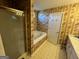 Traditional bathroom with a combination shower and jetted tub at 5627 Isleworth Ct, Atlanta, GA 30349