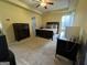 Spacious bedroom with ceiling fan, large bed, computer desk, and a dresser at 5627 Isleworth Ct, Atlanta, GA 30349