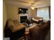 Cozy living room with a fireplace, plush seating, and neutral color scheme at 5627 Isleworth Ct, Atlanta, GA 30349