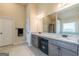 Bathroom with dual sinks, granite counters and modern vanity at 171 Osier Dr, Mcdonough, GA 30252
