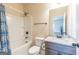 Bathroom with tub and shower featuring modern fixtures and design at 171 Osier Dr, Mcdonough, GA 30252