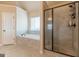 This bathroom features a soaking tub, natural light, and a large tile shower at 171 Osier Dr, Mcdonough, GA 30252