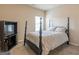 Bedroom with a four-poster bed, patterned bedding, and TV console at 171 Osier Dr, Mcdonough, GA 30252