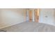 Bedroom showcases neutral carpet, and closet and bathroom access at 171 Osier Dr, Mcdonough, GA 30252
