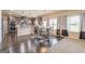 Sunlit dining area features a wood table, neutral rug, and modern chandelier at 171 Osier Dr, Mcdonough, GA 30252
