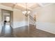 Formal dining room with a coffered ceiling, hardwood floors, and wainscoting at 171 Osier Dr, Mcdonough, GA 30252
