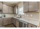 This kitchen features granite countertops and stainless steel appliances at 171 Osier Dr, Mcdonough, GA 30252
