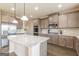 Kitchen features granite countertops, gray cabinets, and stainless steel appliances at 171 Osier Dr, Mcdonough, GA 30252