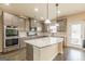 Kitchen features granite countertops, gray cabinets, and stainless steel appliances at 171 Osier Dr, Mcdonough, GA 30252