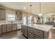 This open-concept kitchen has a granite island, stainless appliances, and seating at 171 Osier Dr, Mcdonough, GA 30252