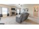 Spacious living room with stone fireplace, comfortable seating, and natural light at 171 Osier Dr, Mcdonough, GA 30252
