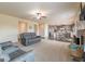 Open concept living area with a fireplace and a view to the kitchen and dining area at 171 Osier Dr, Mcdonough, GA 30252