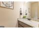 Neutral powder room features granite countertops and decorative wall art at 171 Osier Dr, Mcdonough, GA 30252