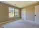 Neutral bedroom features a large window and closet space at 70 Country Meadows Ln, Covington, GA 30014